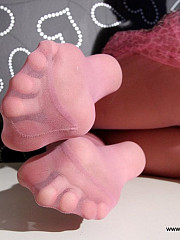Lustful brunette shows her legs in pink - image nr. 2