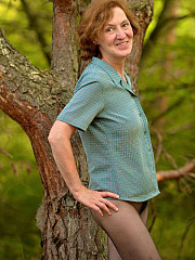 Mature women in nylons posing outdoor - image nr. 2