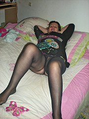 Chubby housewife in black pantyhose on - image nr. 1
